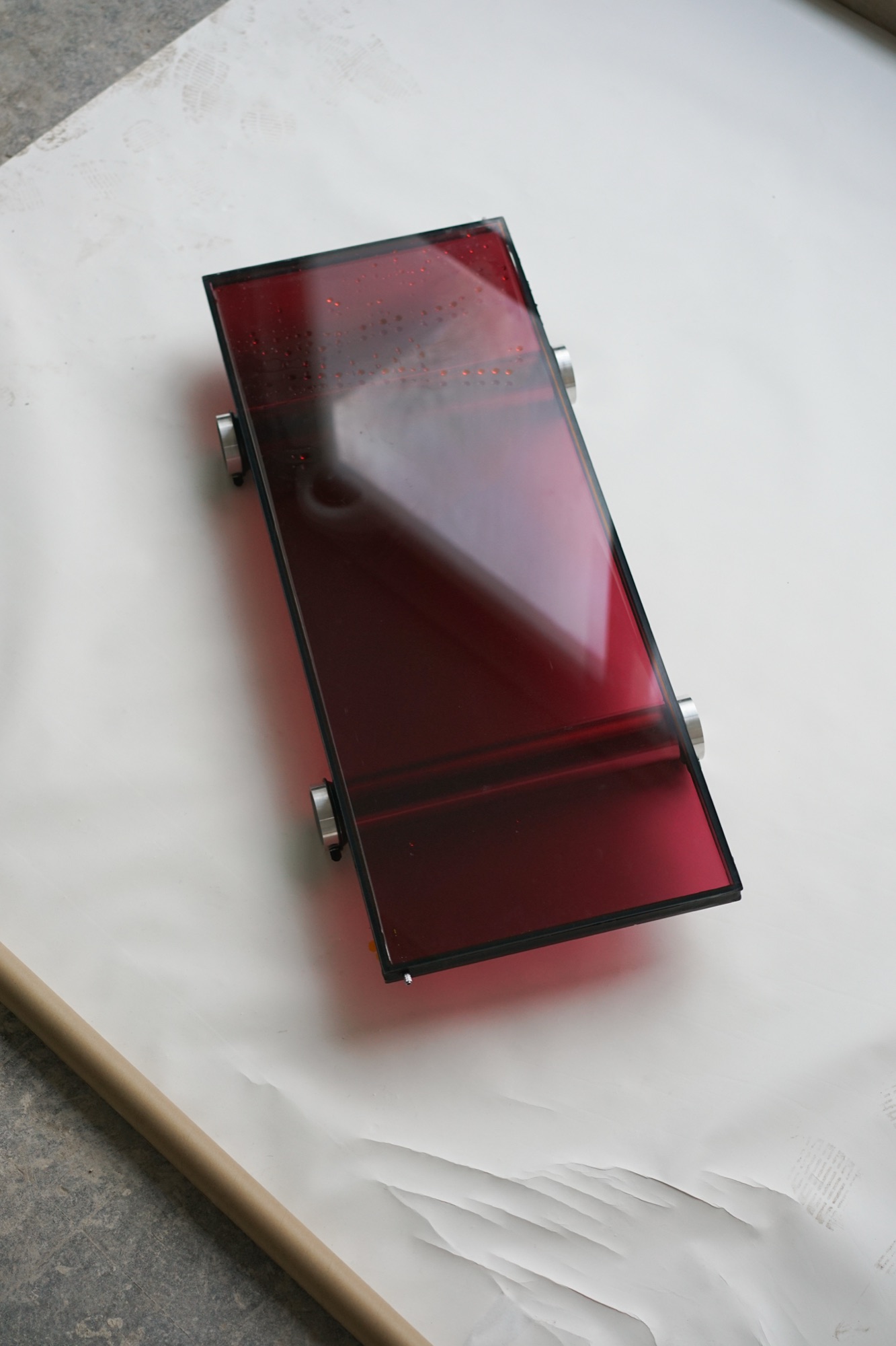 wave chamber — liquid-filled glass pane with shifting color gradients